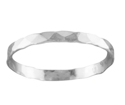 A thin sterling silver hammered ring with a subtle textured finish, displayed against a white background.